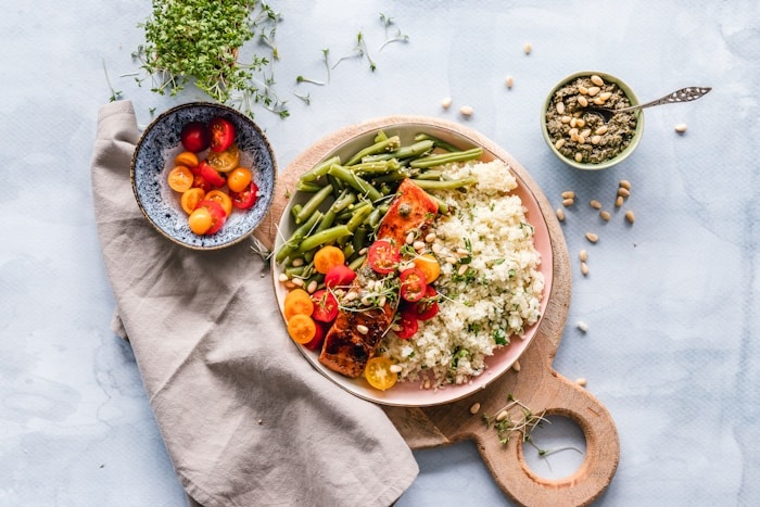 Fresh herbs, greens and cleansing whole foods artfully arranged